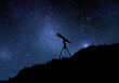 Starry sky with silhouette of telescope