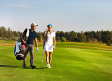 Young Sportive Couple Playing Golf