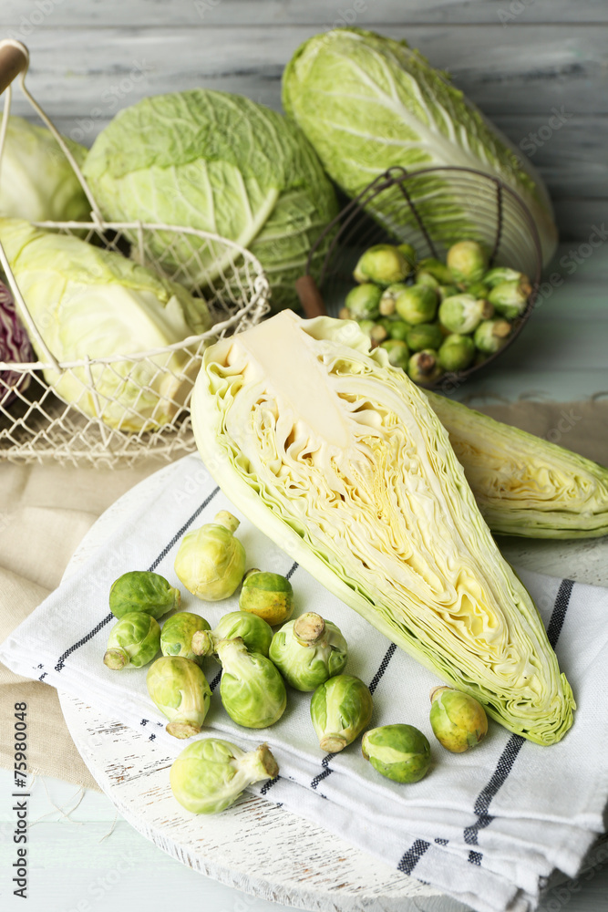 Still life with assortment cabbages on wooden background