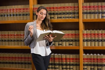 Pretty lawyer reading in the law library