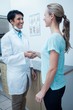 © WavebreakmediaMicro - Female dentist shaking hands with woman