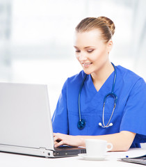 Wall Mural - Young, professional and cheerful female doctor working in office