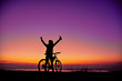 © esteldance - Girl with a bicycle watching the sunset