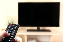 Watching TV And Using Remote Controller