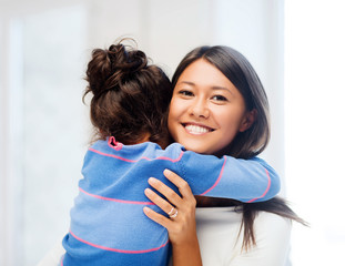 Wall Mural - hugging mother and daughter