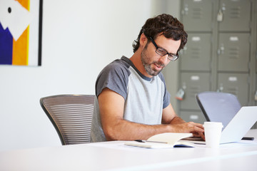 Wall Mural - Casually Dressed Man Working In Design Studio