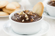 chocolate mousse with biscuits and nuts, close-up