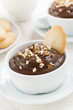 chocolate mousse with biscuits and nuts, vertical