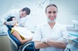 © WavebreakmediaMicro - Smiling female dentist with assistant examining womans teeth