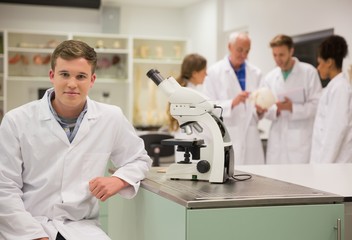 Wall Mural - happy medical student working with microscope