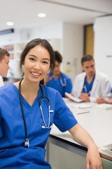 Wall Mural - medical student smiling at the camera during class