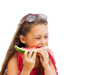 Wall Mural - beautiful little girl in sunglasses eating juicy watermelon