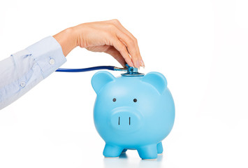 Piggy bank and Stethoscope Isolated on white background