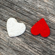 White red hearts on wooden background