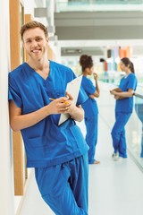 Wall Mural - medical student smiling at camera in hallway