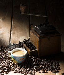 Wall Mural - cup of coffee on the wooden table