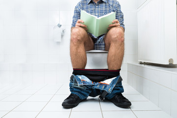 Man In Toilet Reading Book