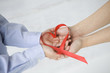 © Monet - Red ribbon in the shape of heart