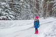 © Cliplab - Little Girl throws snow up and smiles
