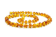 Amber Necklace In Spiral Isolated On The White Background