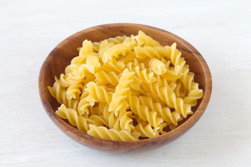 Wall Mural - Italian Macaroni Pasta raw food on wood table