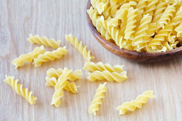 Wall Mural - Italian Macaroni Pasta raw food on wood table