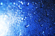 © Africa Studio - Water drops on color surface background, macro view