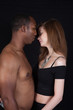 © Allen Penton - Mixed racial couple in a thoughtful, romantic attitude