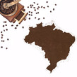 Coffee powder in the shape of Brazil and a coffee mill.(series)