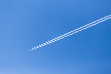 Trace Of An Airplane In The Blue Sky