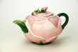 Rose teapot isolated on white background