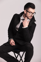 Canvas Print - Handsome elegant business man sitting on a stool