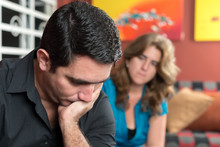 Divorce - Sad Hispanic Husband And His Worried Wife