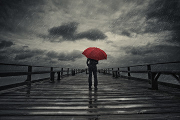 red umbrella in storm