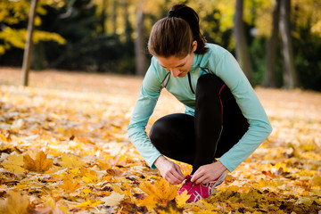 Sticker - Woman tying shoelaces - jogging in nature