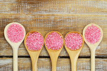 Pink Sugar On Wooden Spoons With Copy Space