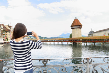 Tourist taking photograph in Lucerne Switzerland