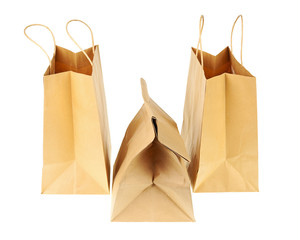 Empty brown recycled paper shopping bags isolated on white backg