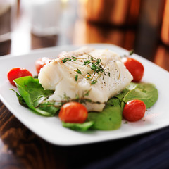 halibut with spinach, cherry tomatoes and thyme