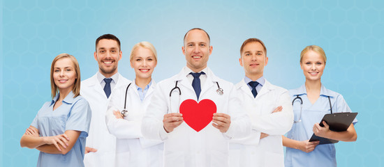 Poster - group of smiling doctors with red heart shape