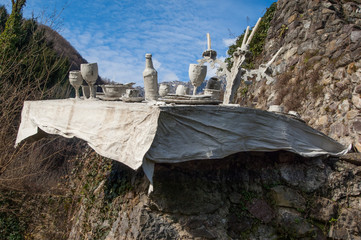 Wall Mural - sculpture of table set in the mountain