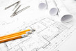 © gargantiopa - Construction blueprints on the worktable and drawing instrument
