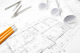 Fototapeta  - Construction planning drawings rolled on the worktable