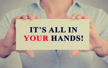 businesswoman hands holding card It's All in Your hands message