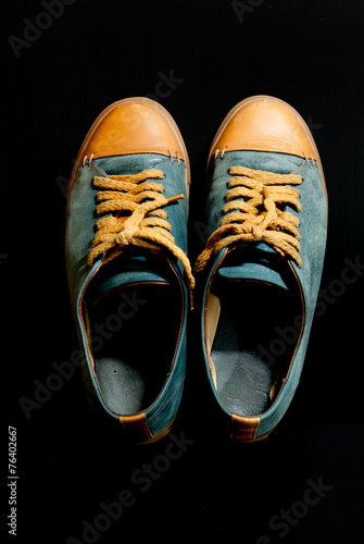 Fotografija gray leather basketball shoe sneaker, isolated on black