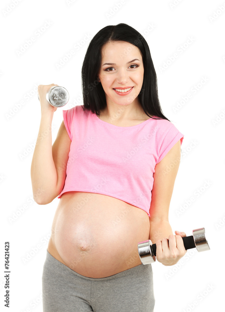 Young pregnant woman with dumbbells isolated on white