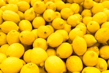 Wall Mural - Colorful Display Of Lemons In Fruit Market