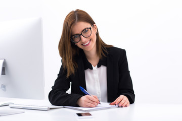 Poster - Young smiling businesswoman working at the office