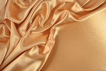 Background from golden satin fabric