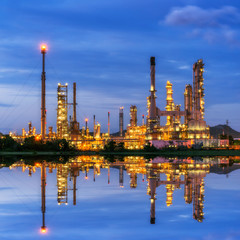 Wall Mural - Oil refinery at twilight - petrochemical industry with water ref